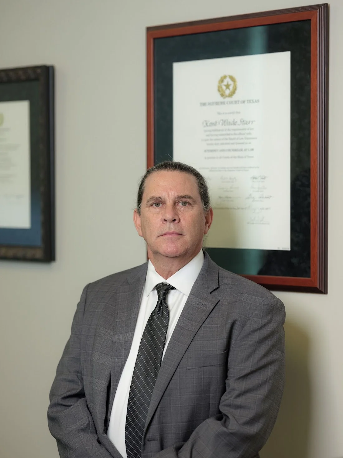 Kent Starr, attorney, in his office at the Texas Supreme Court attorney certificate.